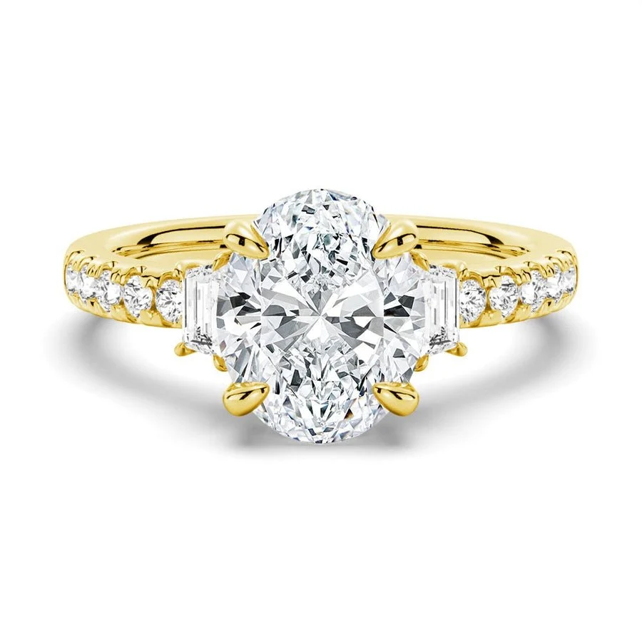 Yellow gold three-stone oval moissanite engagement ring top view with half-moon side accents