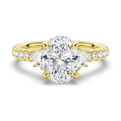 Yellow gold three-stone oval moissanite engagement ring top view with half-moon side accents