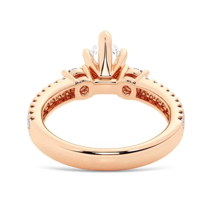 Rose gold three stone pear moissanite engagement ring back profile view