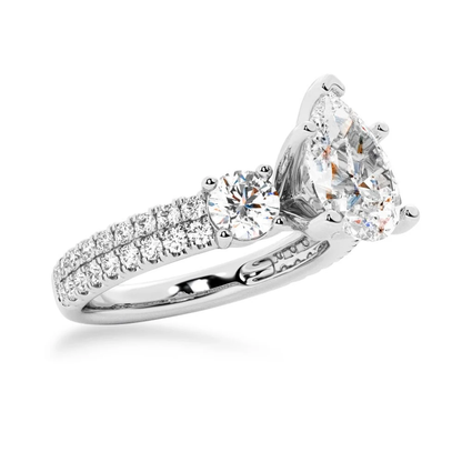 White gold three stone pear moissanite ring 3/4 perspective view showing double row pave setting