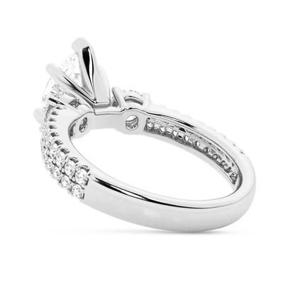 White gold three stone pear moissanite engagement ring direct side view
