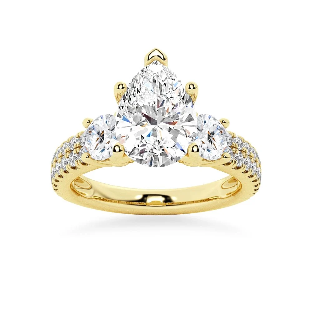 Yellow gold three stone pear moissanite engagement ring top view with double row pave band
