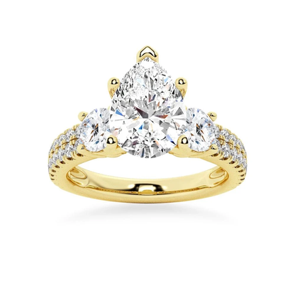 Yellow gold three stone pear moissanite engagement ring top view with double row pave band