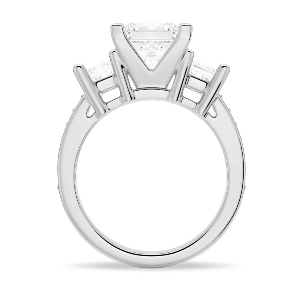 White gold three-stone princess-cut moissanite engagement ring direct side profile view showing prong setting and pave shank