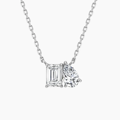 White gold Toi et Moi emerald cut and pear moissanite two stone pendant necklace top view-Novelle Vow