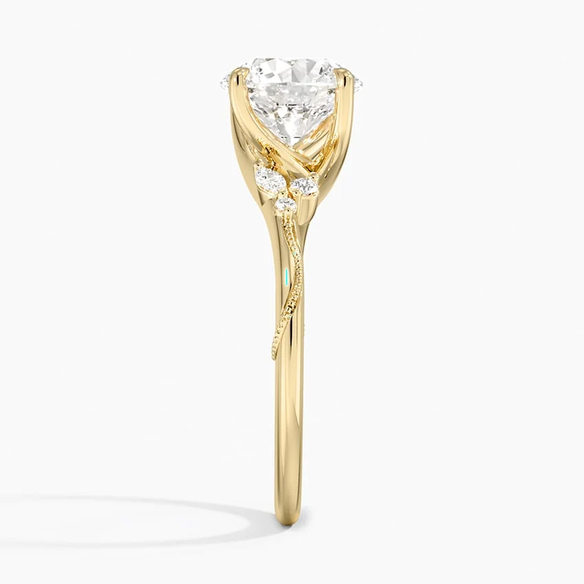 Side profile view of yellow gold round moissanite solitaire ring with delicate vine motif