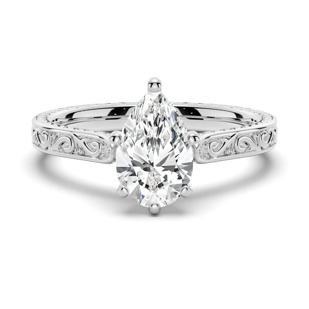 White gold vintage pear-cut moissanite engagement ring top view displaying engraved band with milgrain edges-NOVELLE VOW