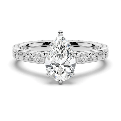White gold vintage pear-cut moissanite engagement ring top view displaying engraved band with milgrain edges-NOVELLE VOW