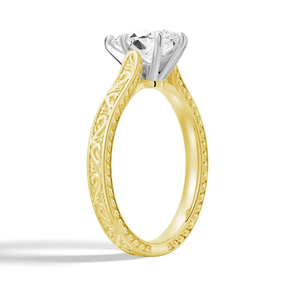 Yellow gold vintage pear-cut moissanite engagement ring 3/4 angle view with milgrain engraved band