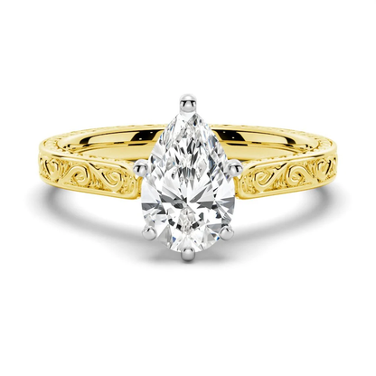 Yellow gold vintage pear-cut moissanite engagement ring top view with antique scrollwork
